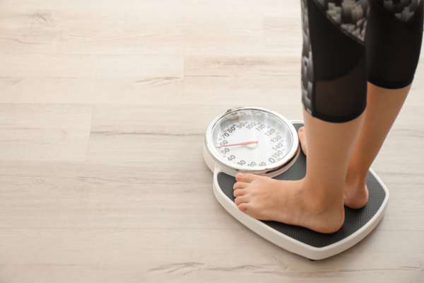 woman standing on scale