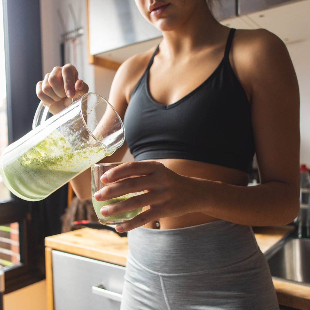 woman pouring a healthy drink woman pouring a healthy drink