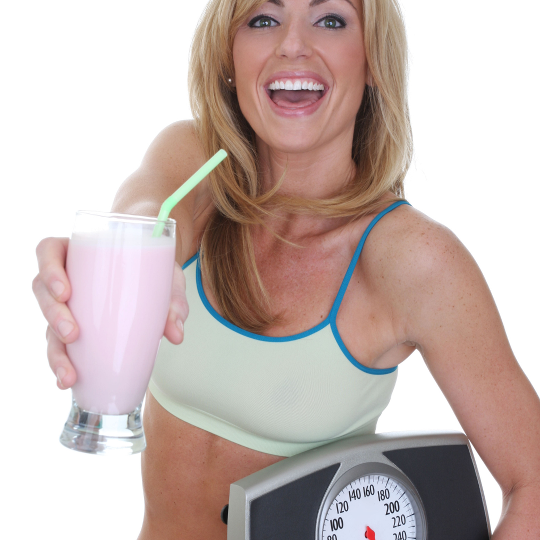 woman with scale and protein shake woman with scale and protein shake